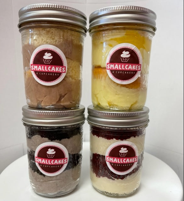 Four Smallcakes cupcake jars stacked two by two